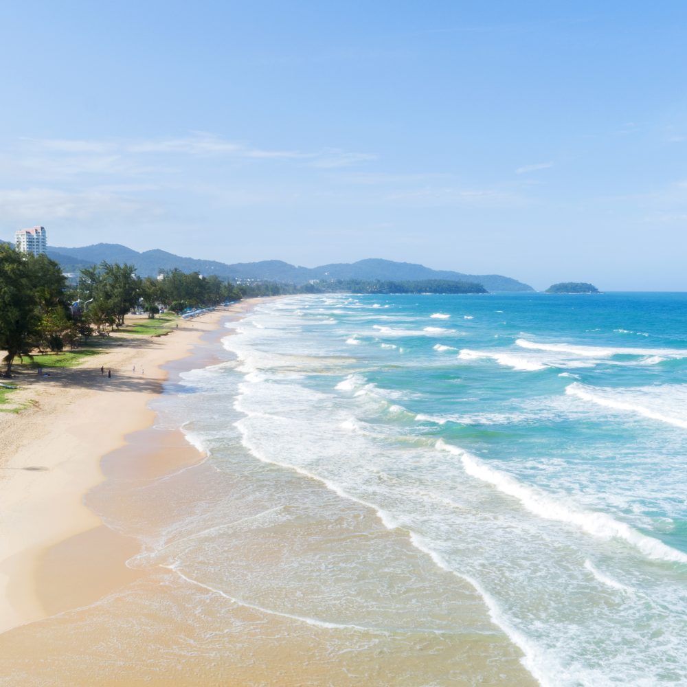 Thaiwander Travel Best Tour Agency in Bangkok, Thailand Beautiful Wave Crashing On Sandy Shore At Karon Beach In Phuket