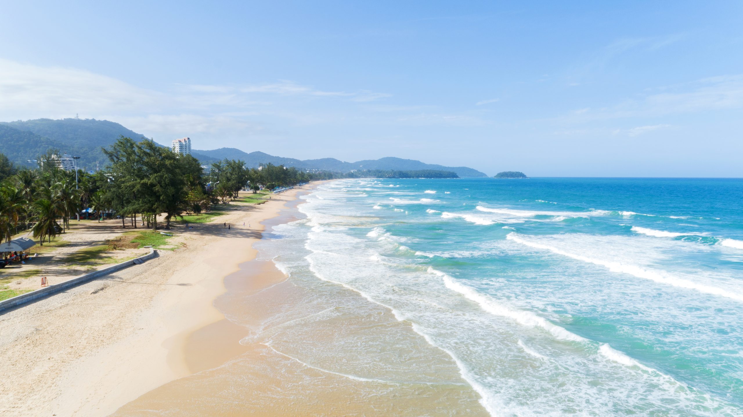 Thaiwander Travel Best Tour Agency in Bangkok, Thailand Beautiful Wave Crashing On Sandy Shore At Karon Beach In Phuket