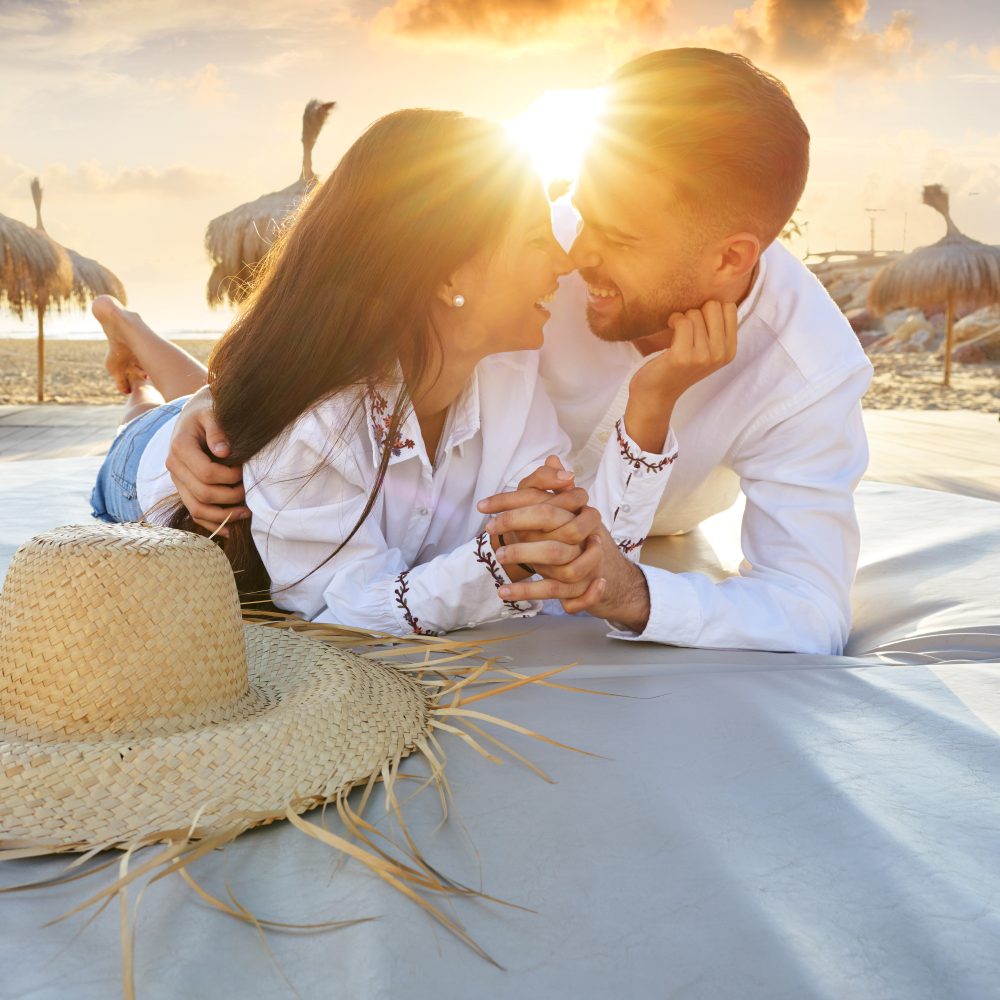 Thaiwander Travel Best Tour Agency in Bangkok, Thailand Couple Young On Beach Lounge Sunset