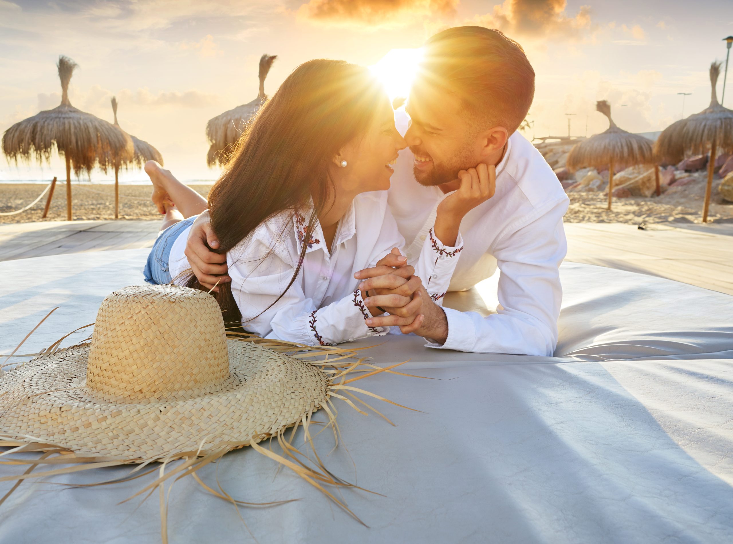 Thaiwander Travel Best Tour Agency in Bangkok, Thailand Couple Young On Beach Lounge Sunset