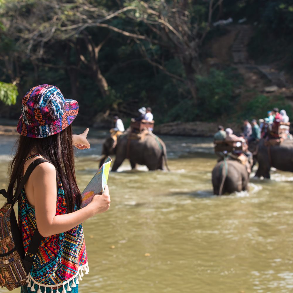 Thaiwander Travel Best Tour Agency in Bangkok, Thailand Female Tourists On Hand Have A Happy Travel Map.