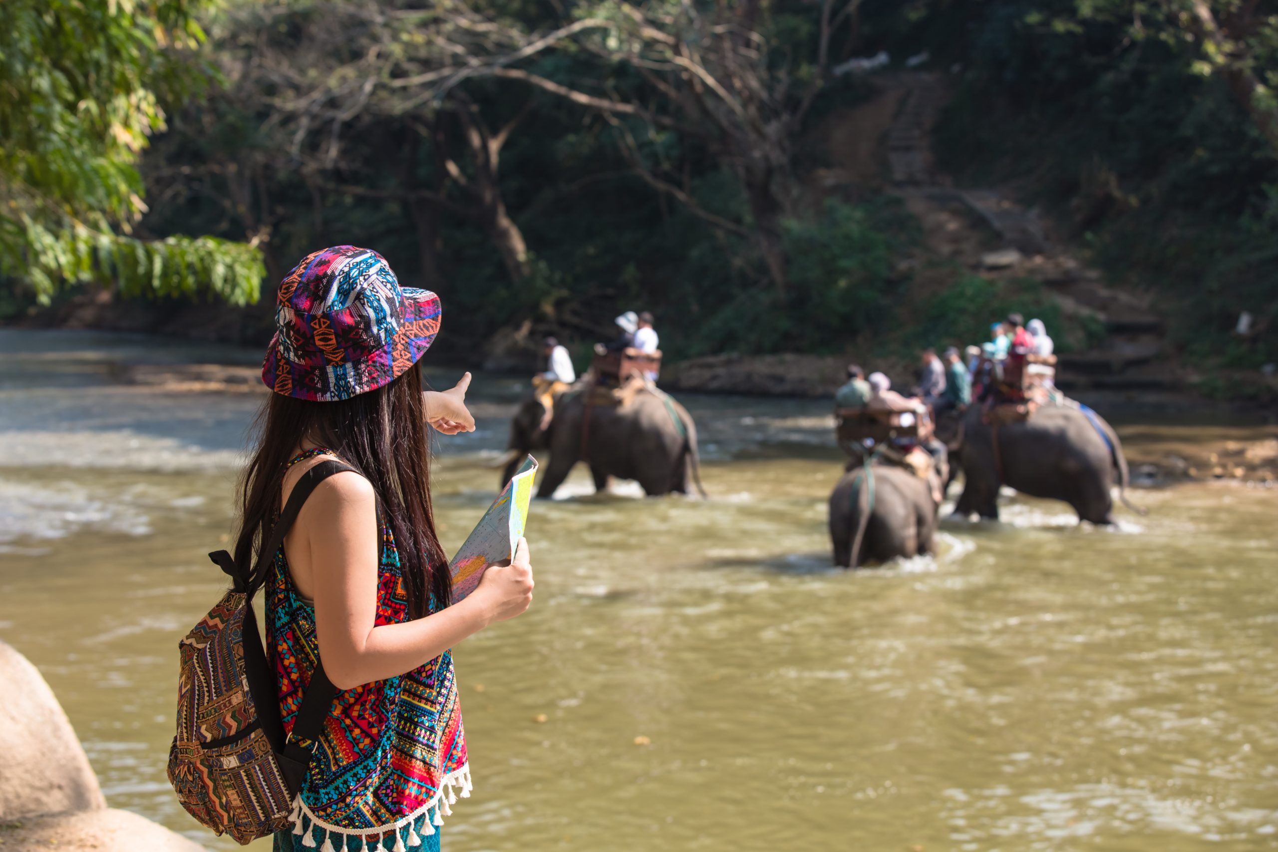 Thaiwander Travel Best Tour Agency in Bangkok, Thailand Female Tourists On Hand Have A Happy Travel Map.