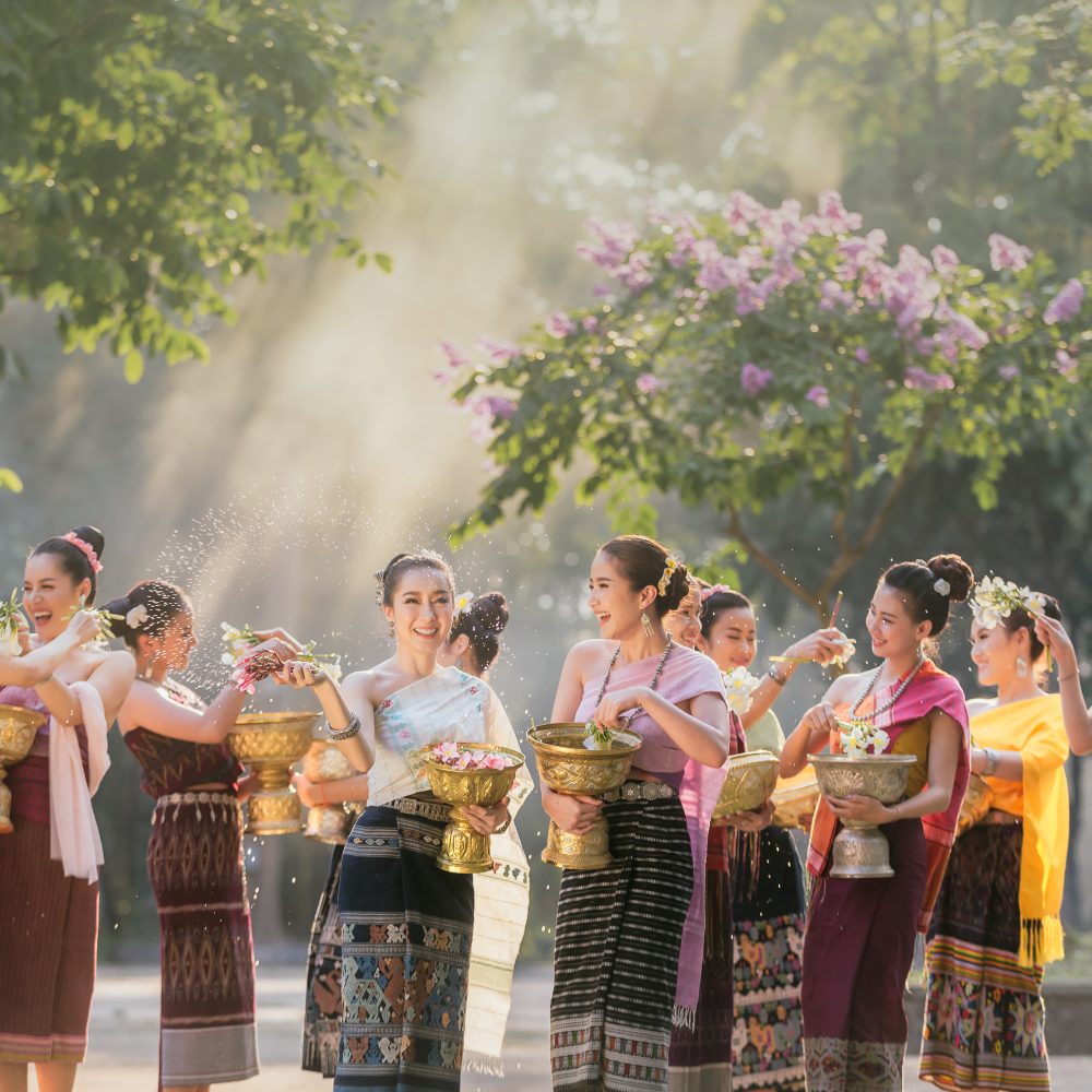 Thaiwander Travel Best Tour Agency in Bangkok, Thailand Laos Girls Splashing Water During Festival Songkran Festival