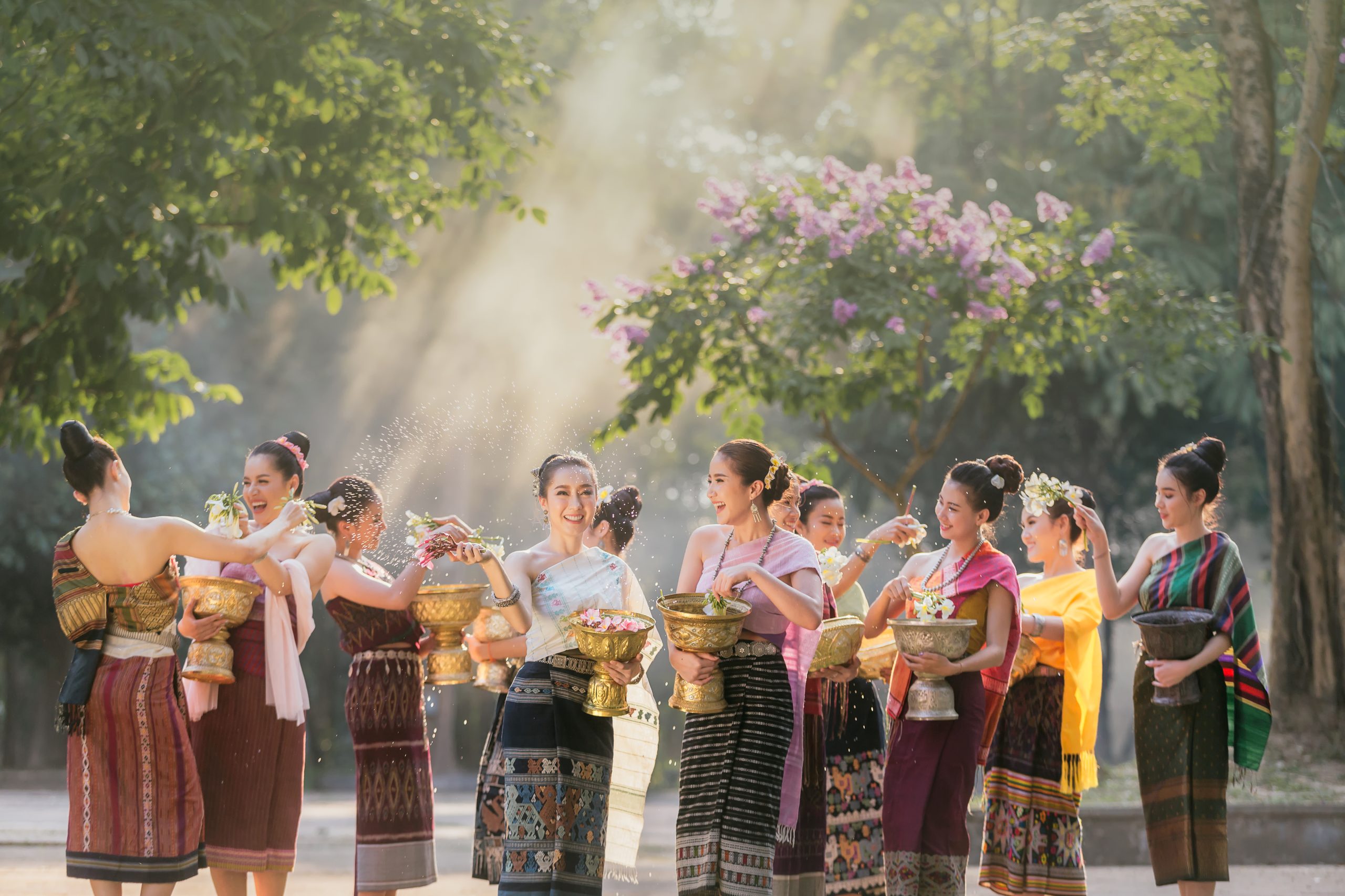 Thaiwander Travel Best Tour Agency in Bangkok, Thailand Laos Girls Splashing Water During Festival Songkran Festival